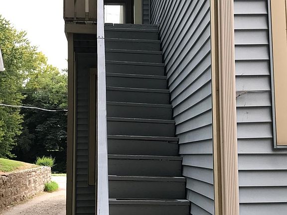Rear entry way to upstairs unit