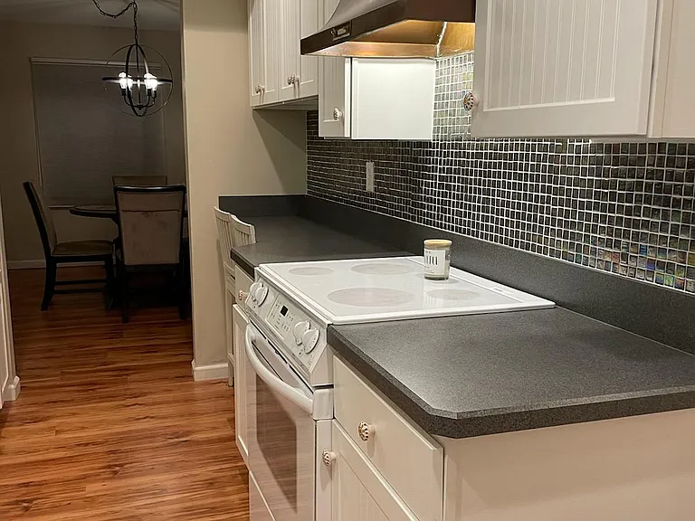 Galley kitchen with computer counter/ small breakfast area