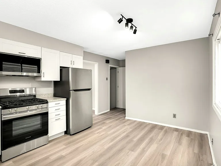 Functional eat-in kitchen layout with ample cabinet and counter space