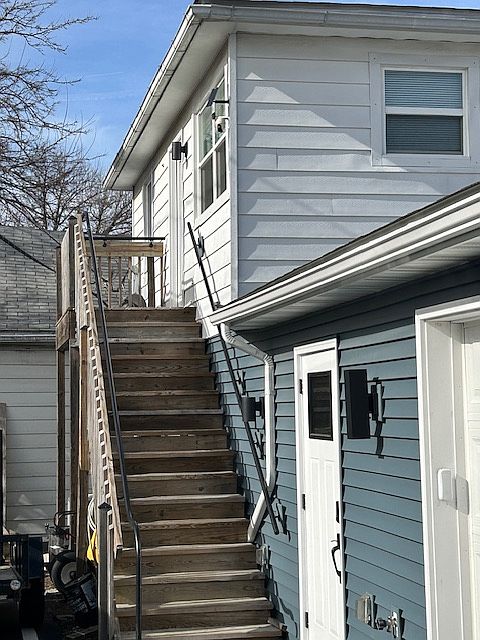 Stairs leading to Entry Door
