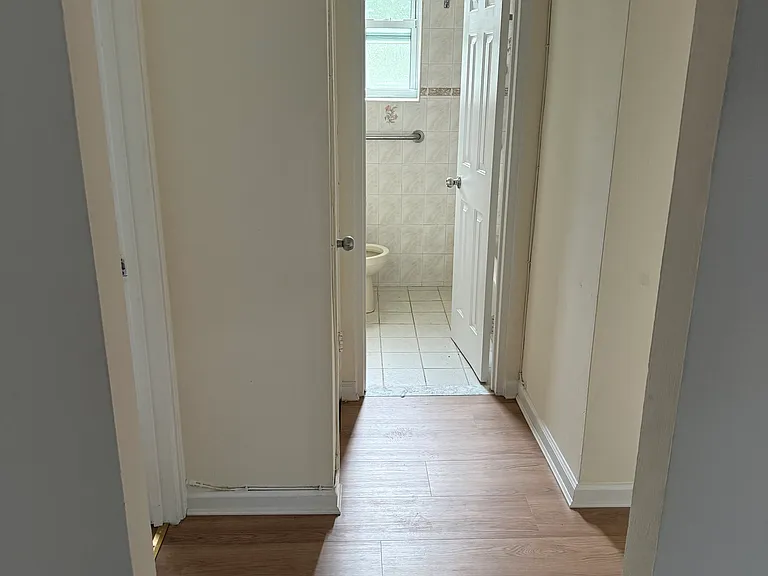 Hallway between 2 bedrooms and bathroom