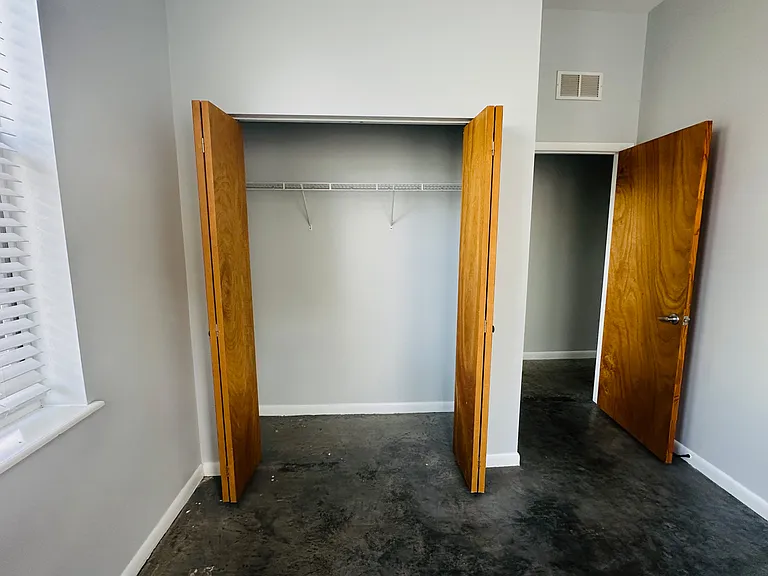 Downstairs Bedroom with closet. Comes with blinds.