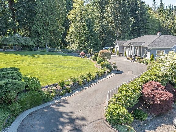 Impressive paved drive from entrance to shop with sidewalks built in...