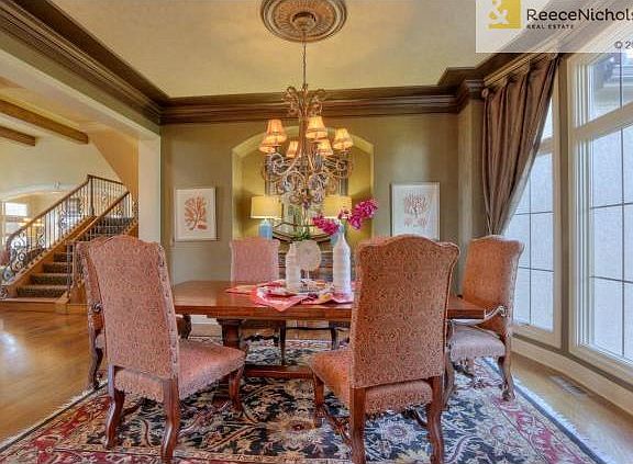 Formal dining room with buffet niche, hardwood floors, and floor