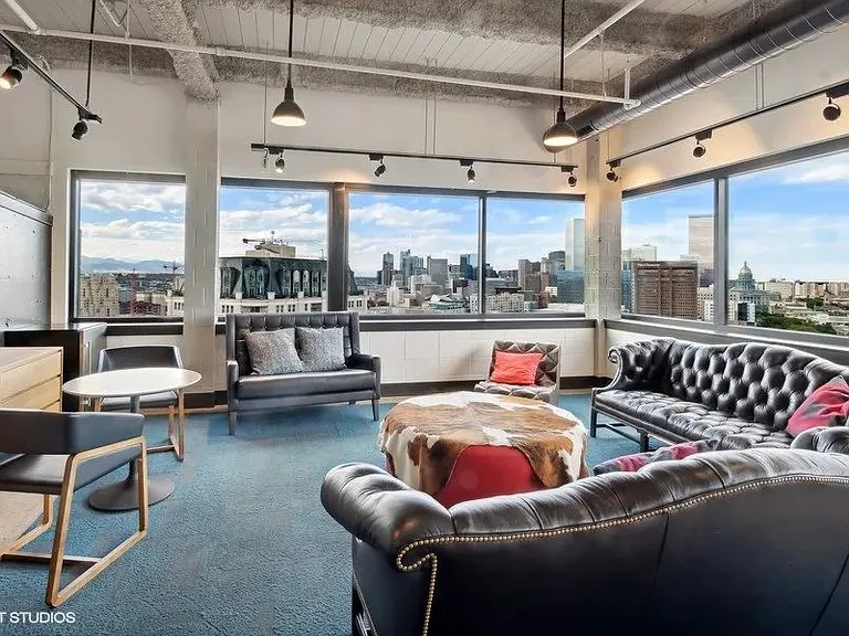 Penthouse entertainment lounge with comfortable seating at Archer Tower in Denver, CO