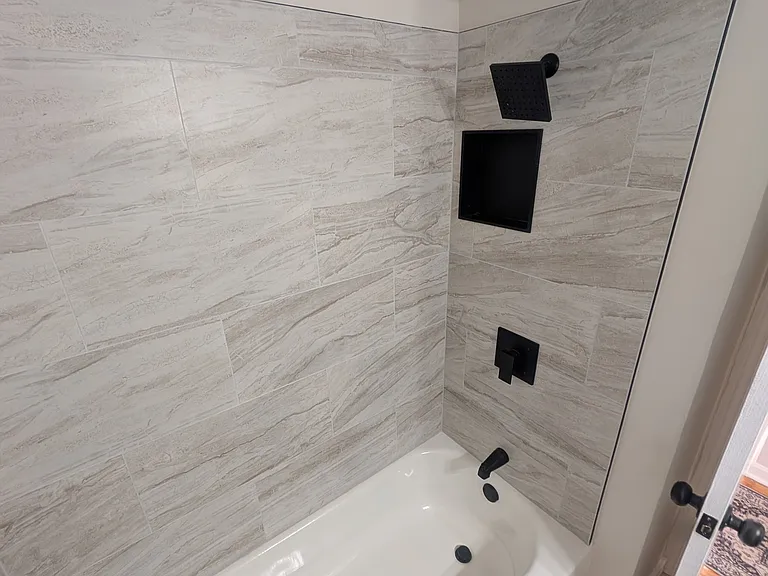 12x24 tile tub surround with new mixer valve and black finishes
