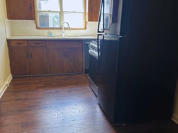 Updated Kitchen including Dishwasher, Gas Stove, Hood Vent, and Refrigerator