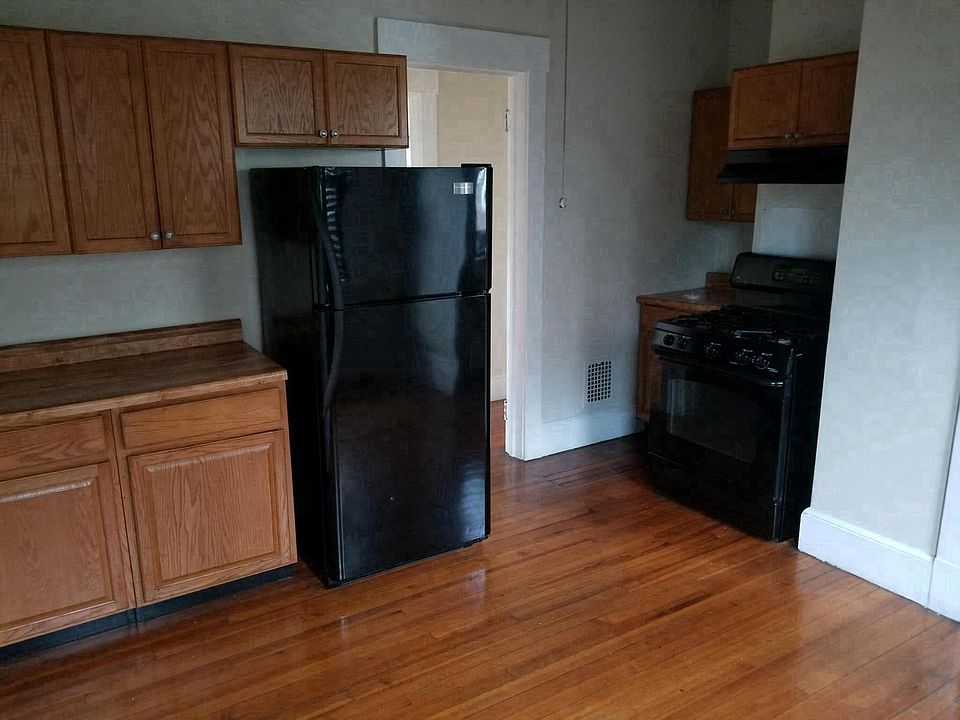 Beautiful kitchen with hardwood floor and small pantry area.