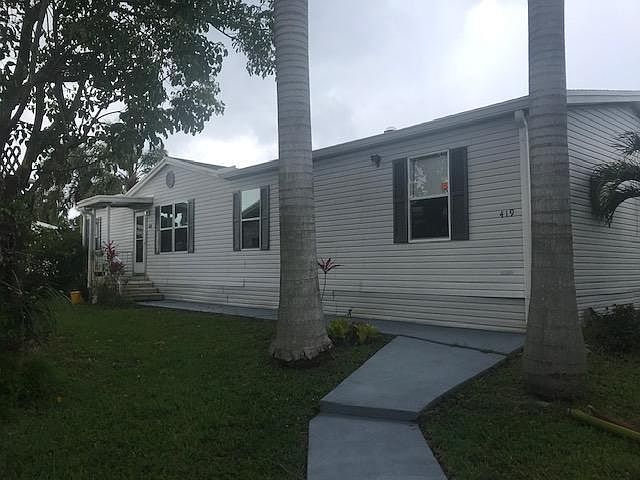 Large Florida Palms by Entrance way