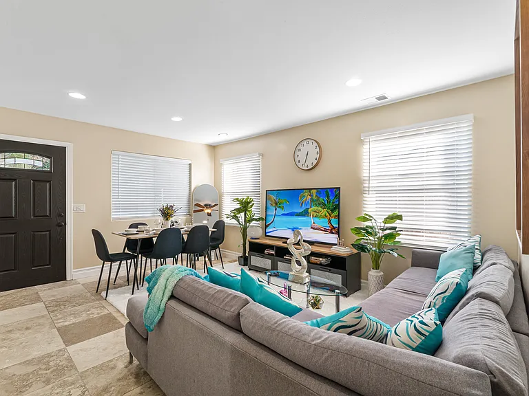 Living room bathed in natural light, creating a warm and inviting atmosphere!