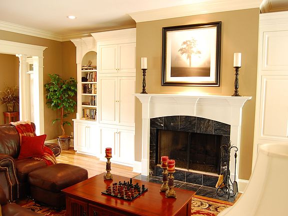 Bountiful Great Room with Built-ins, Stunning Fireplace and Arched Entrance 