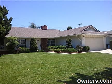 View of house front from sidewalk