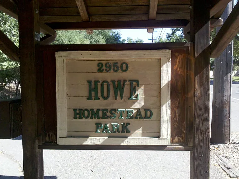 Walking distance to Howe Homestead Park, featuring picnic areas, gardens, and direct access to scenic hiking and biking trails just behind the home