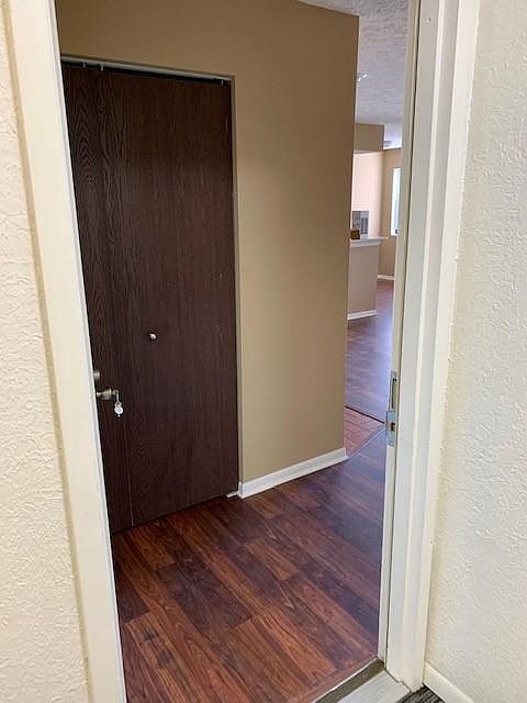 Entry from common hallway to unit- entry coat closet