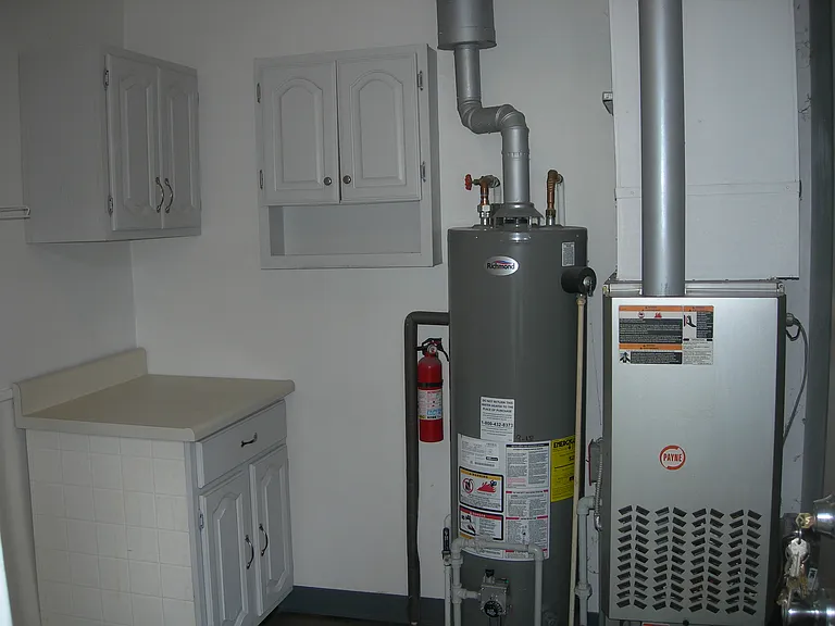 Gas hot water and forced air furnace.