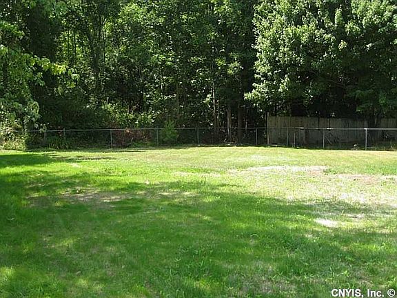 Exterior Front. Beautiful, large, and  partially fenced yard