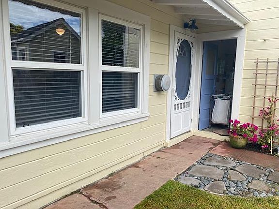 front windows and door of cottage studio.