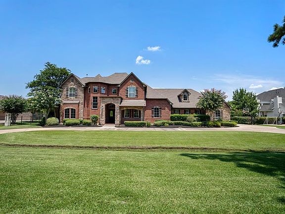 Stunning custom home in the wonderful private neighborhood of Estates section of Gleannloch Farms. Luscious landscaping welcomes guests into the home and extends into the backyard space. The home features a 4 car oversized garage with built-ins and e