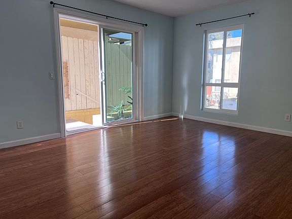 Spacious living area. Outside is the private patio and secure entrance.