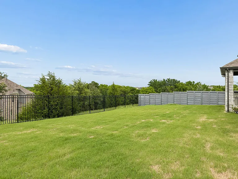 Peaceful views of the backyard with cedar trees and plenty of sky!
