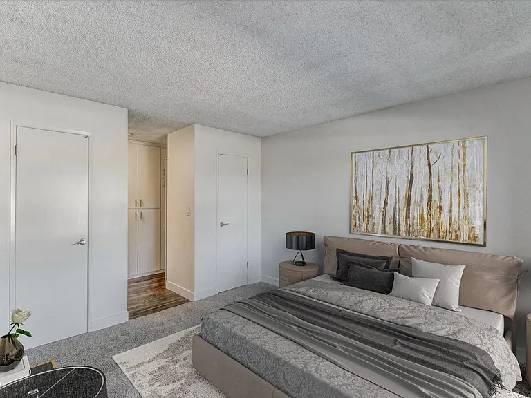 Bedroom with double side closet doors
