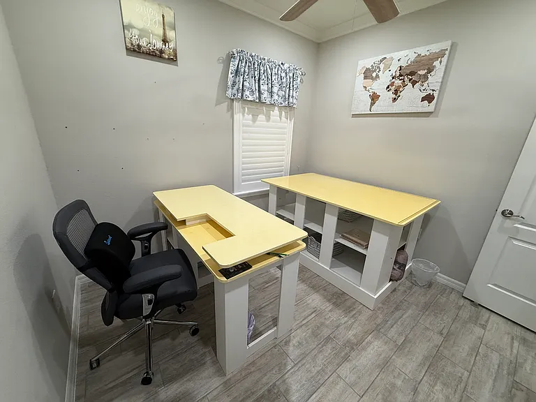 Bedroom #3 is a craft room with large work table and sewing table (or adaptable to other work)