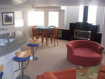 Living and Dining Area With exposed Fireplace