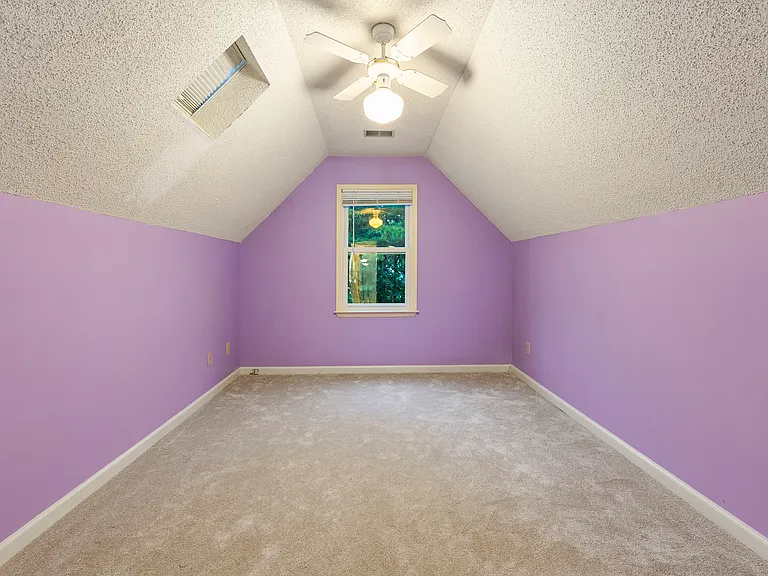 Third bedroom upstairs. This is a smaller room. Window overlooking the front yard. Vinyl window, replaced in 2018. Skylight window at the ceiling.