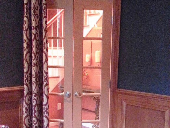 Library with chair rail and high ceiling