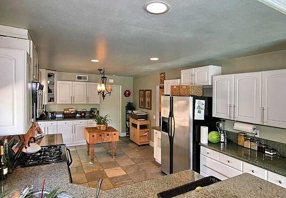 Remodeled Kitchen has lovely granite counters, slate flooring & new cabinets.