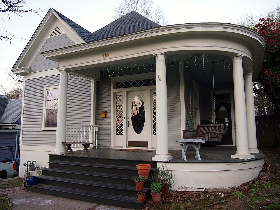 Wrap-around porch with swing