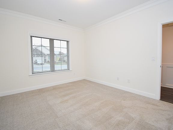 A second view of the first floor guest bedroom. The closet is located behind the camera.