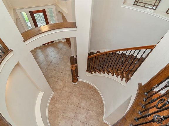 This is the grand view of the entryway area and rotunda looking down from the landing upstairs.
