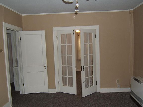 Living room and french doors to bedroom