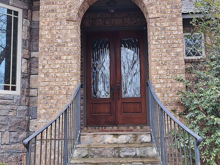Double door front entry with leaded glass panels