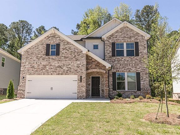 Exterior of the Atwood, two story home with a private driveway and attached garage.
