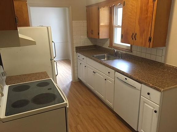 Appliances include stove, refridgerator, and dishwasher.