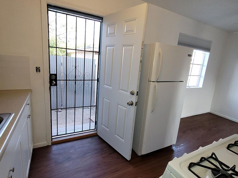 Kitchen with screen door to parking