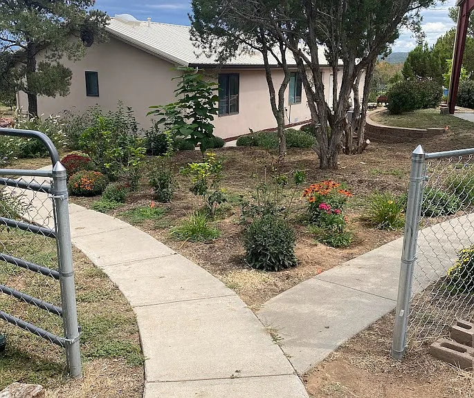 View of back walkway coming from neighbors home.