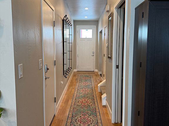 Hall that leads to kitchen, small dining area, and living room