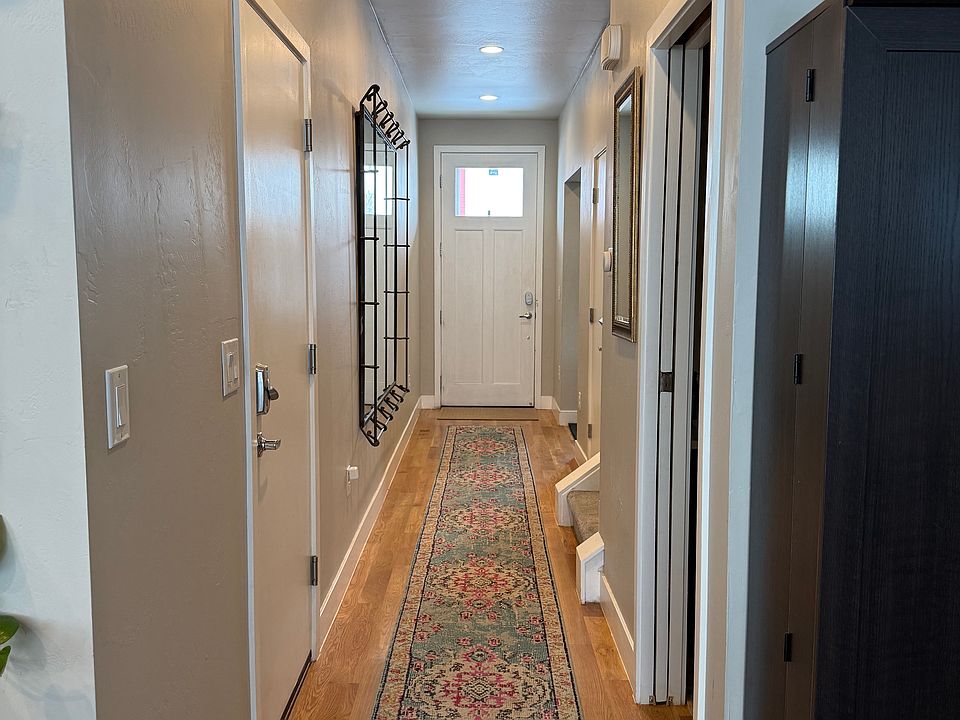 Hall that leads to kitchen, small dining area, and living room