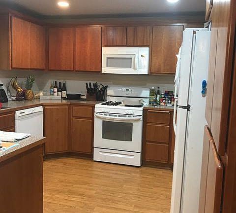 large kitchen over looks back yard