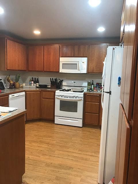 large kitchen over looks back yard