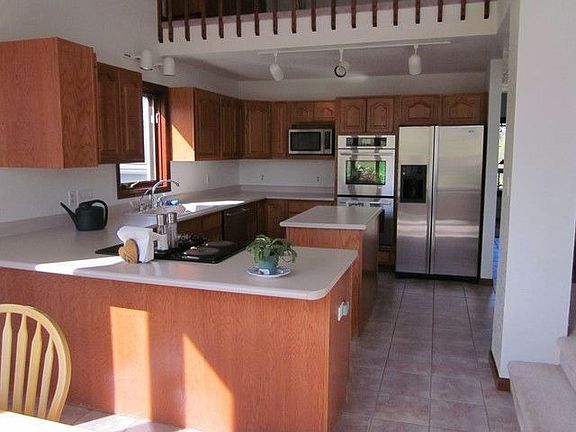 Open kitchen with stainless steel appliances