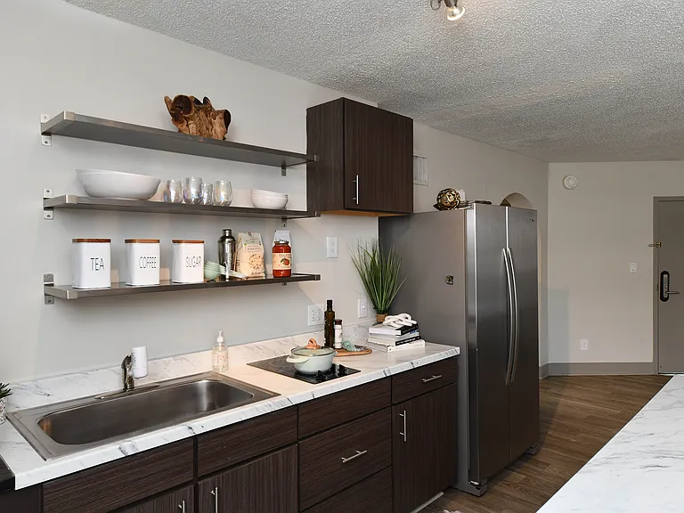 Kitchen with quartz counters, modern cabinetry, and stainless appliances