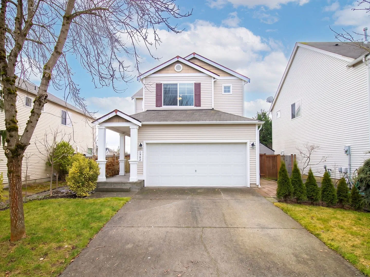 Inviting 3-Bedroom Spanaway Home with Fireplace, Covered Porch & Two-Car Garage! — Photo 1