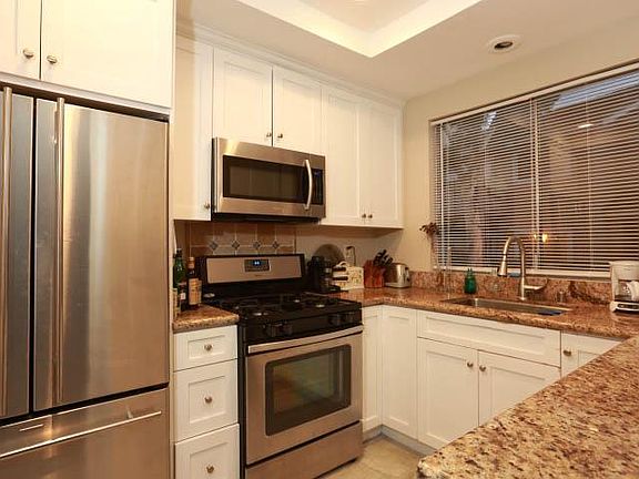 updated kitchen with gas stove and builtin microwave