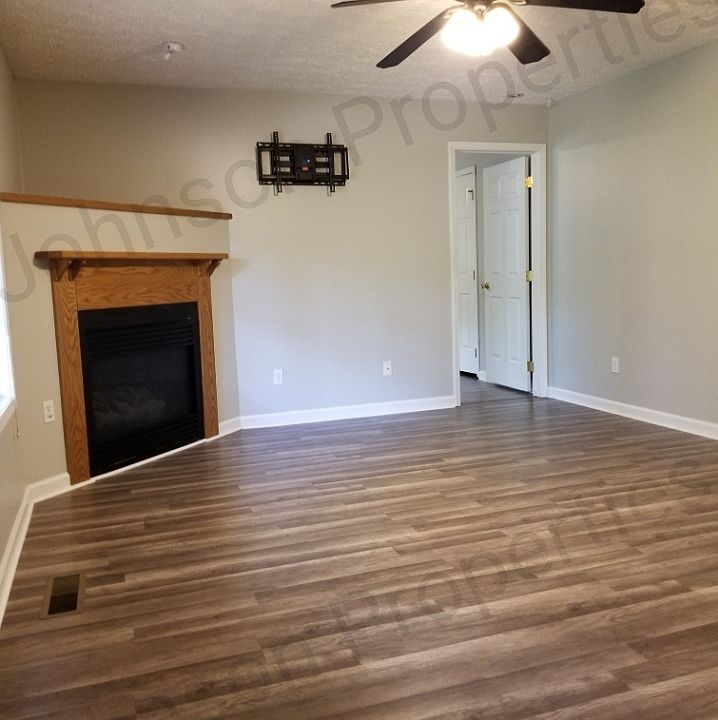 Functional direct vent gas fireplace with remote control start and Oak surround.