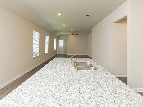 Dining Area and Kitchen to Family Room