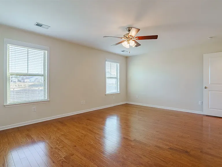 Beautiful large primary suite on the main level of the home with large closet and bathroom.